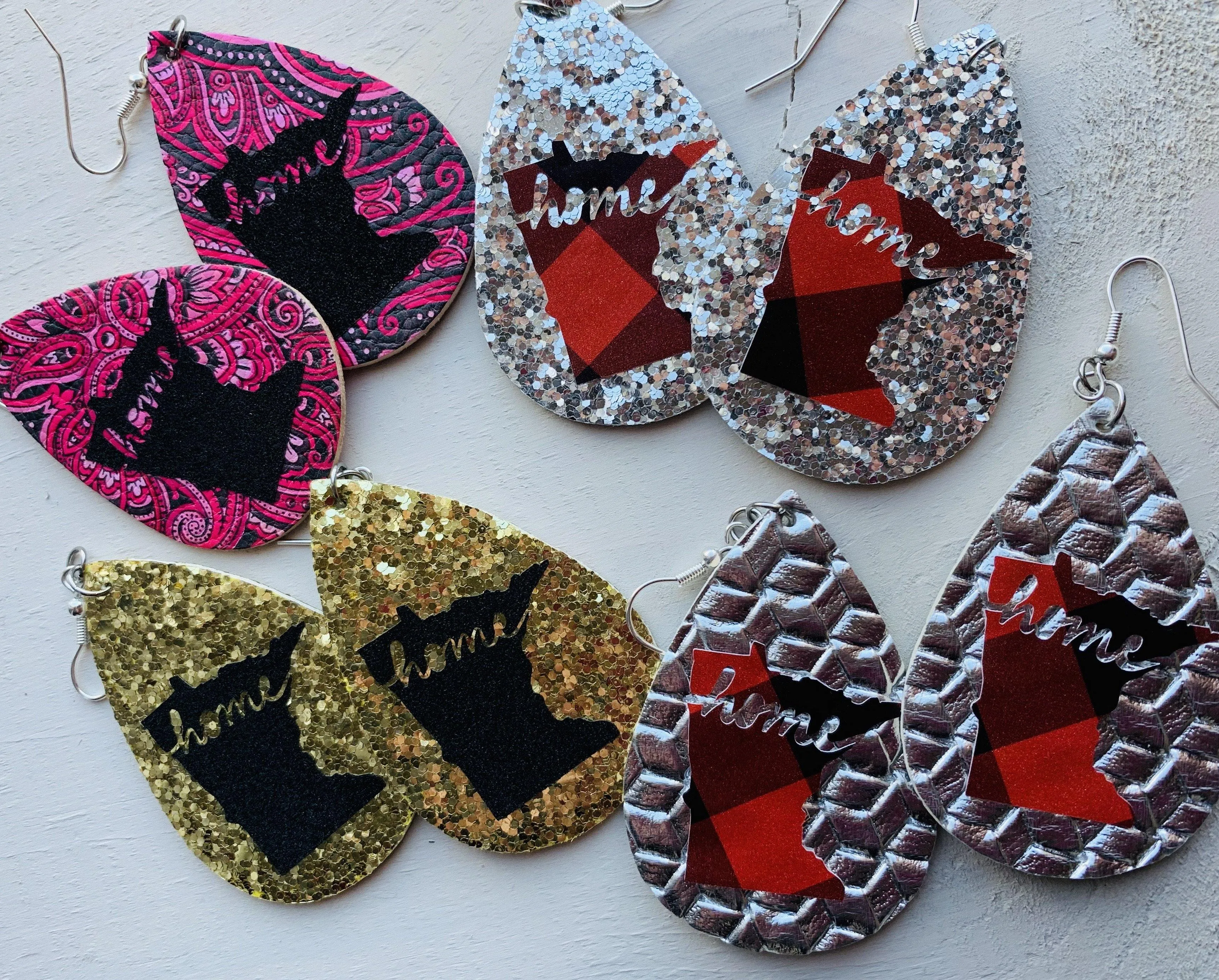 Earrings { Home } Minnesota. Leather teardrops starts of Mn. Fish hook style. Silver. Assorted colors.