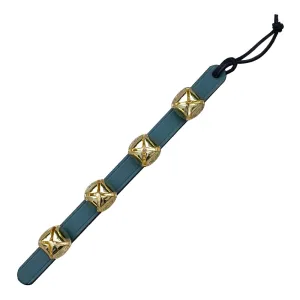 Hanging Brass Bells on Green Leather