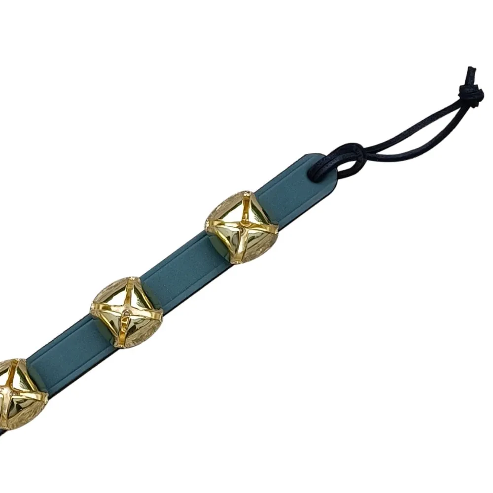 Hanging Brass Bells on Green Leather