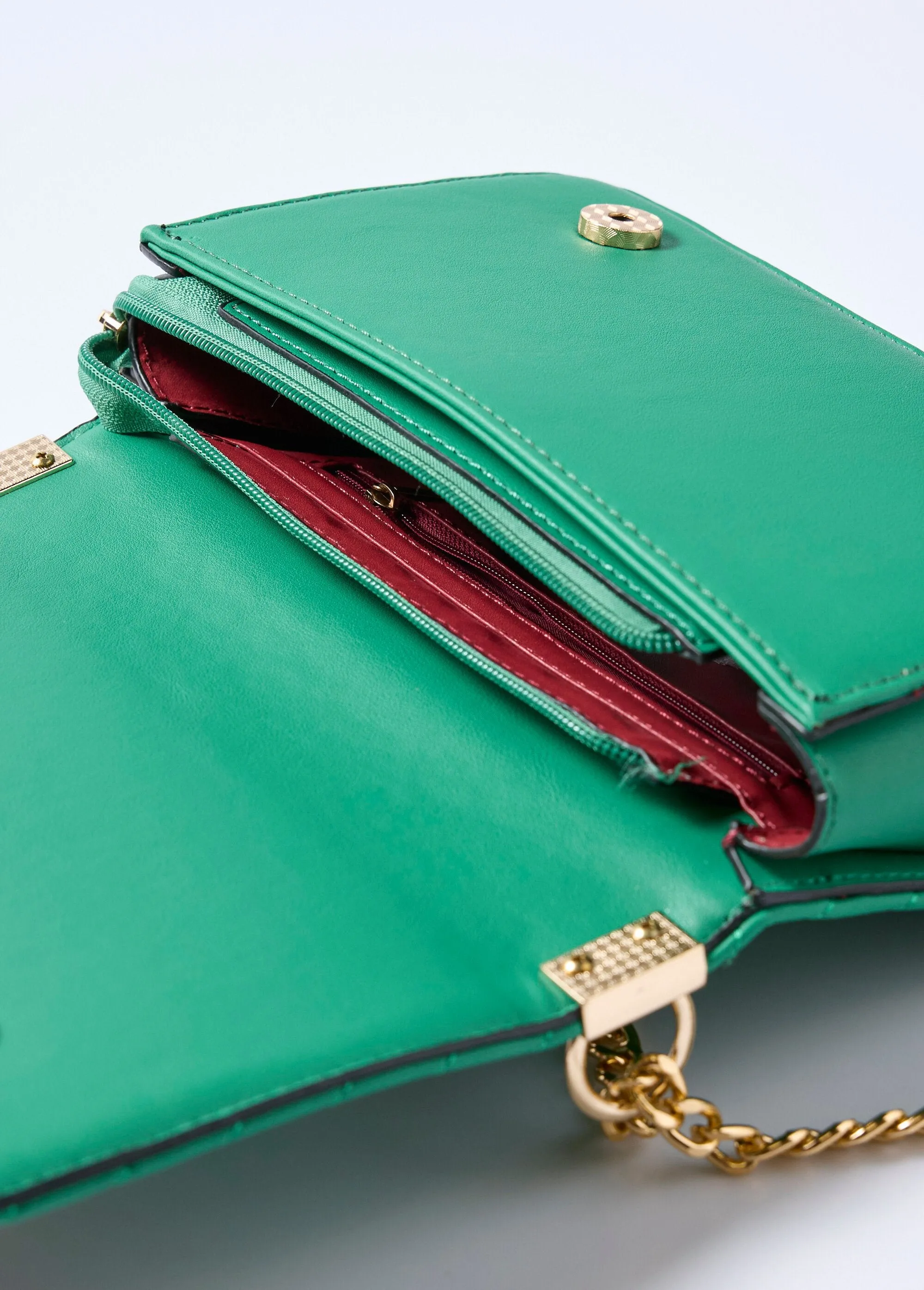 Quilted clutch bag with chevron stitching