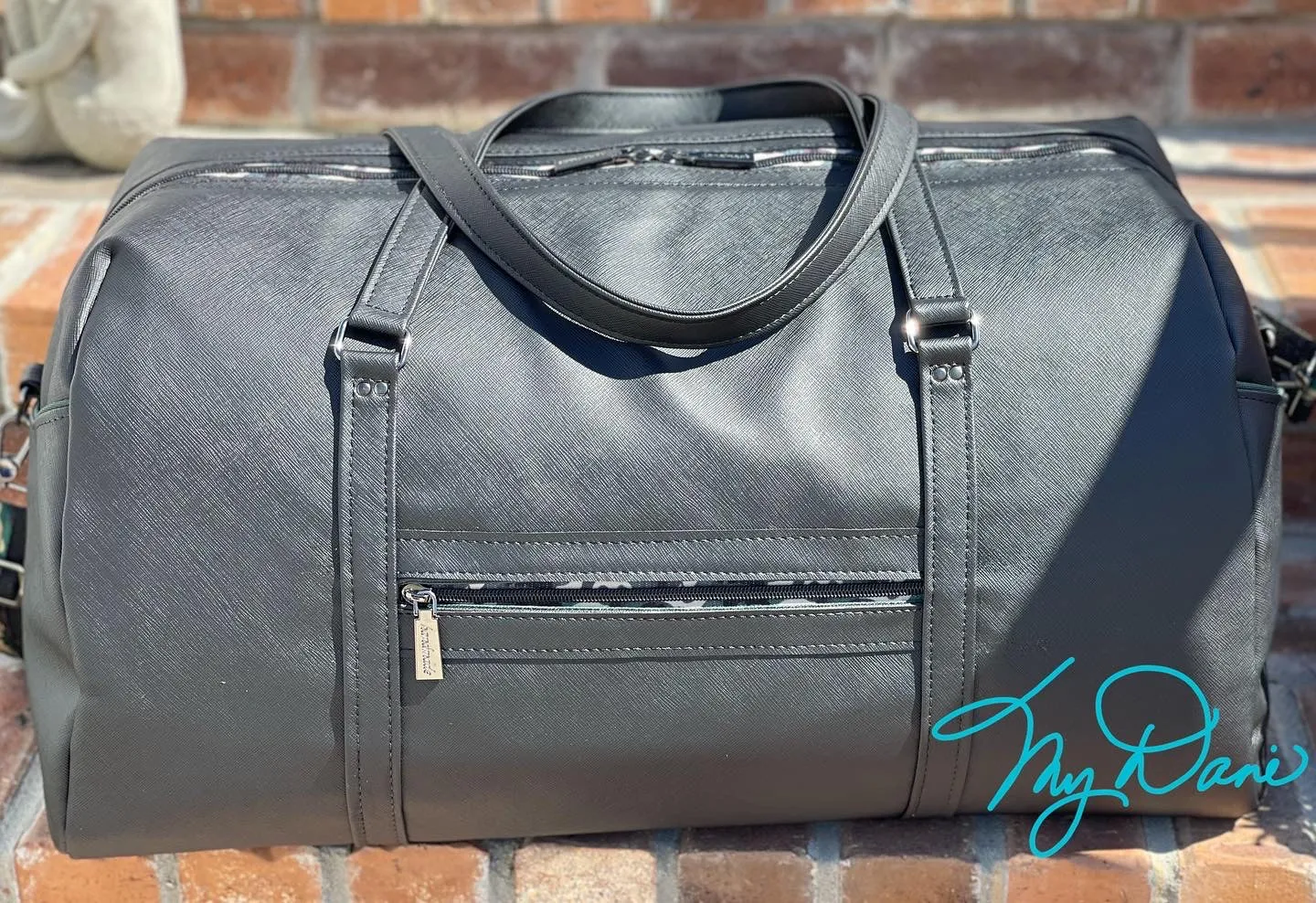 The Coalition Duffle Bag in Black Modern with Camo