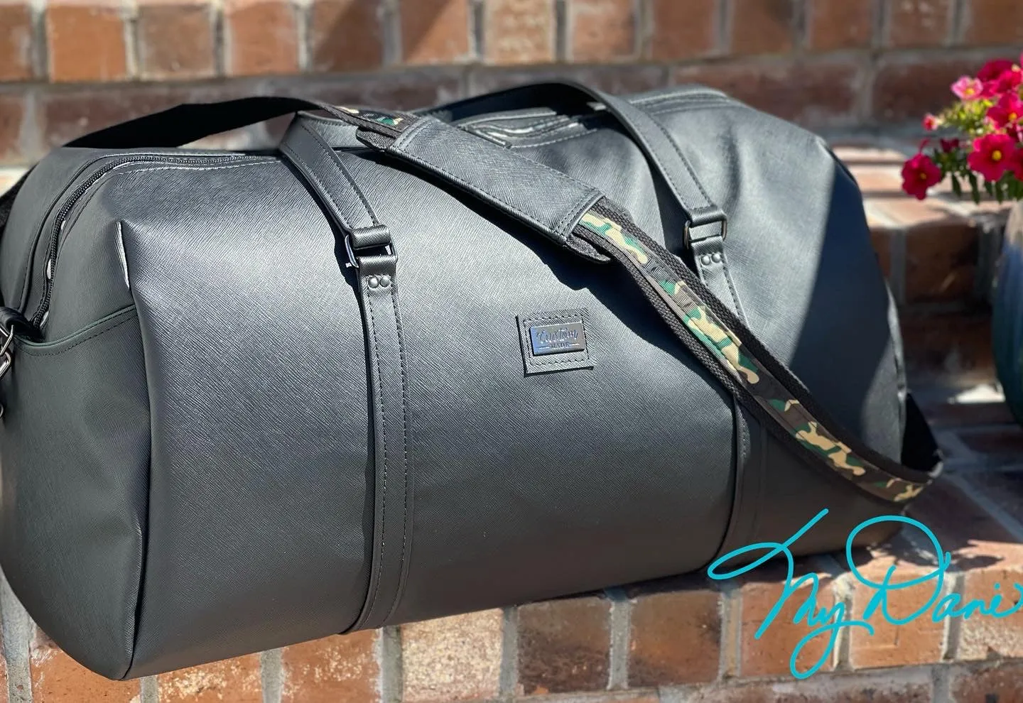 The Coalition Duffle Bag in Black Modern with Camo